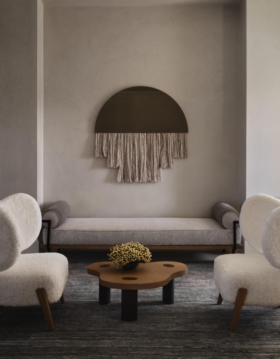 organic furniture and macrame art in muted tones of brown and cream