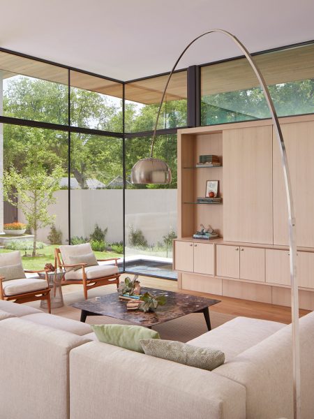 Texas Modern - Book edited by Hannah Jenkins Texas Modern Caruth Residence living area with lots of windows and modern overarching floor lamp by Jean Liu Design